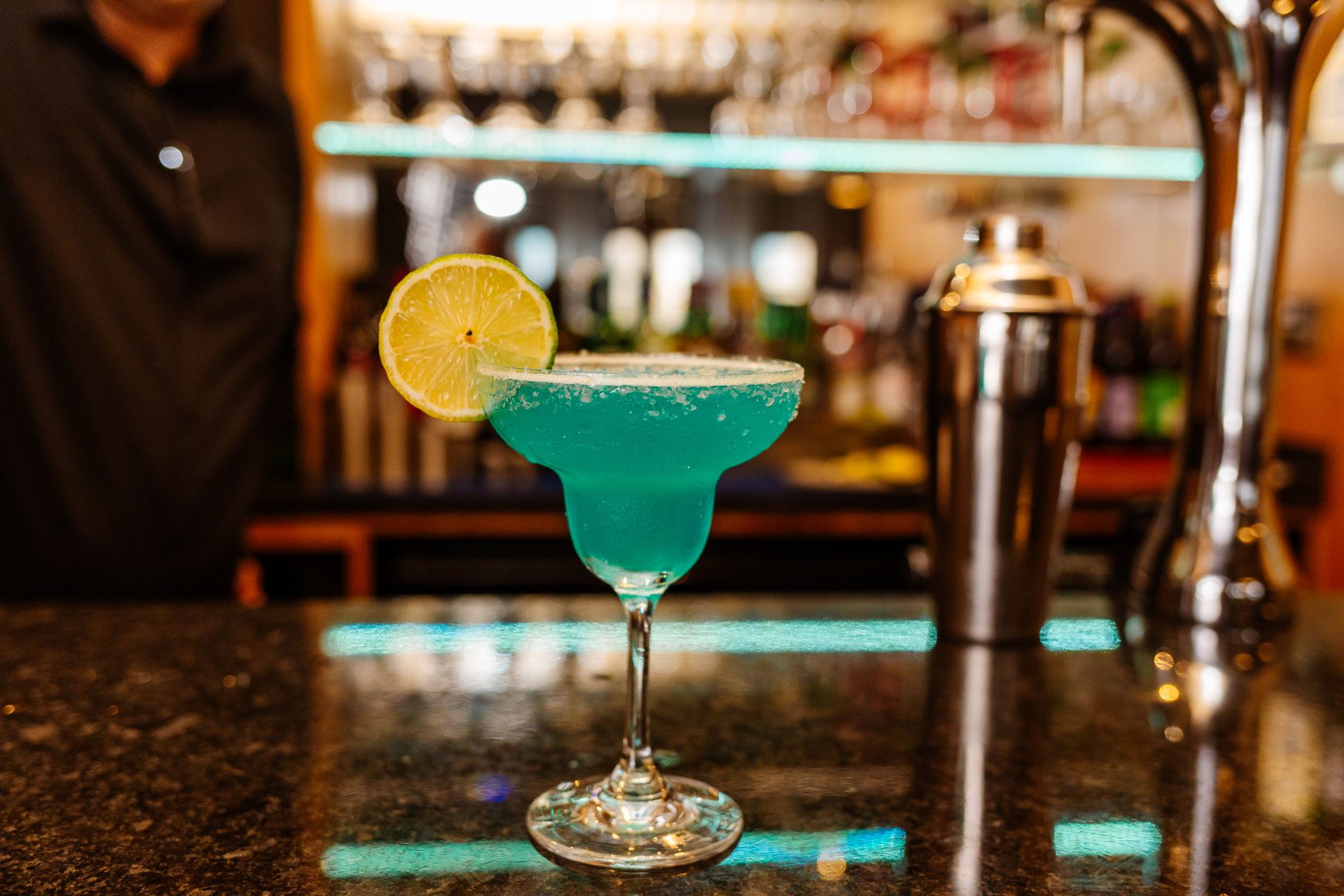 A blue lagoon cocktail on a bar 